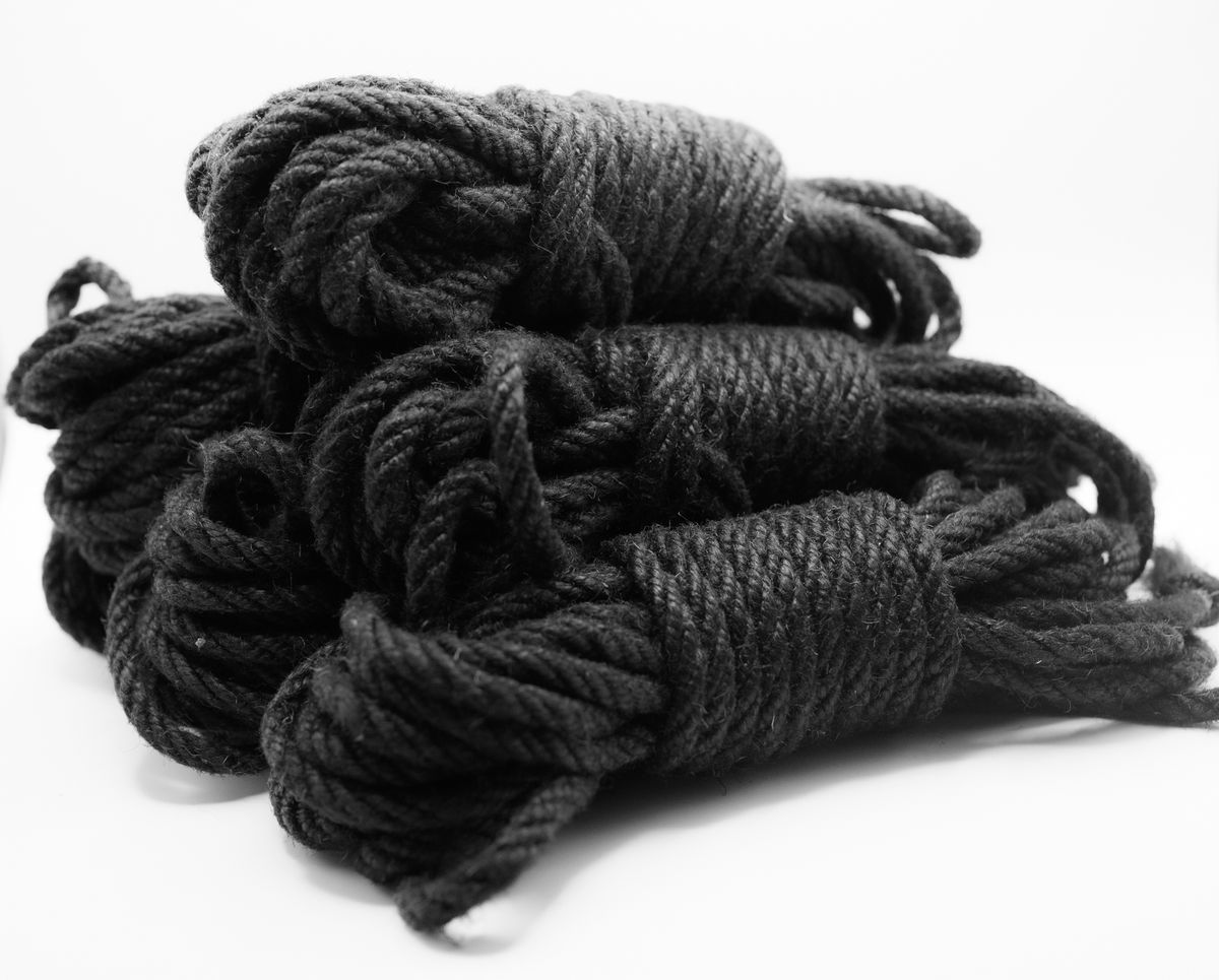 Five hanks of black jute rope